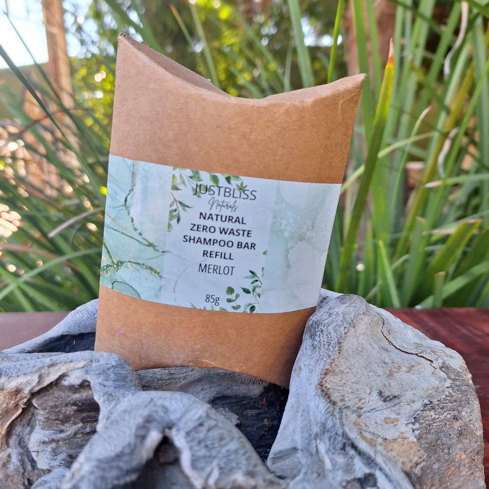 Eco-friendly Shampoo Bar Refill in kraft packaging on a natural background.