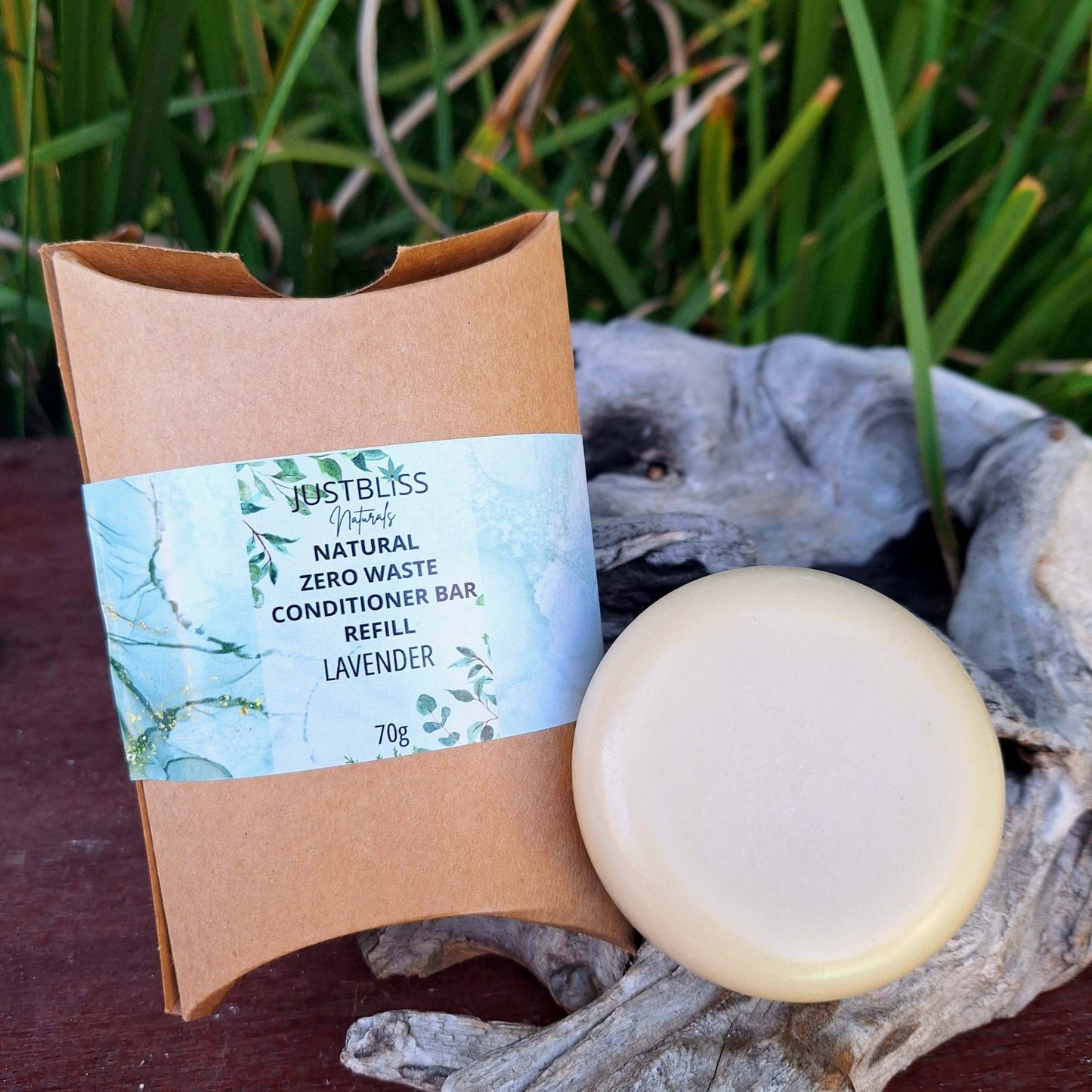 Eco-friendly Shampoo Bar Refill with plant-based ingredients, suitable for all hair types; packaged in sustainable kraft paper.