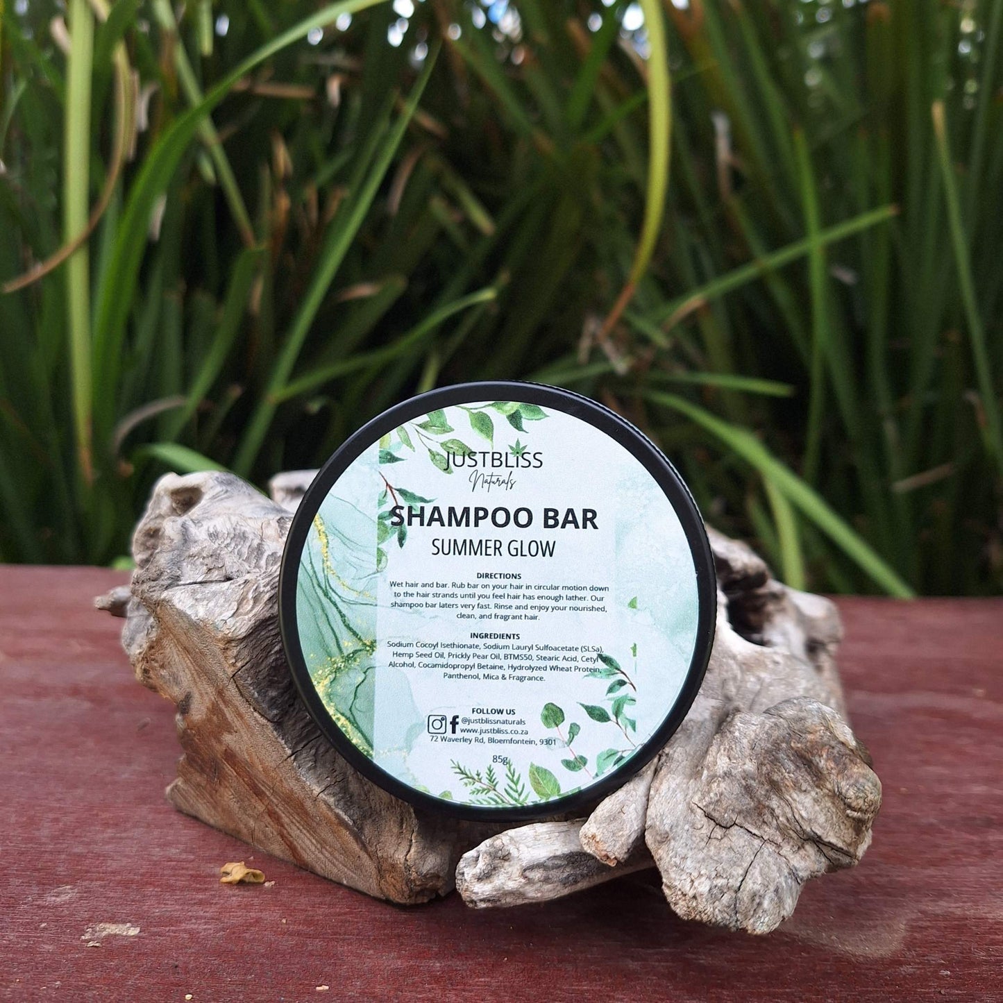 Eco-friendly Shampoo Bar in reusable tin for all hair types, featuring plant-based ingredients like Hemp Seed and Prickly Pear oils for hydration and strength.