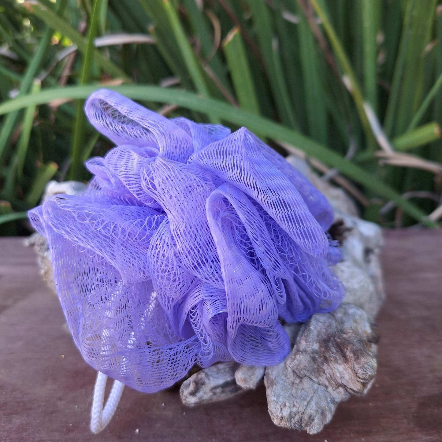 Purple bath & shower scrunchies for exfoliating and cleansing.