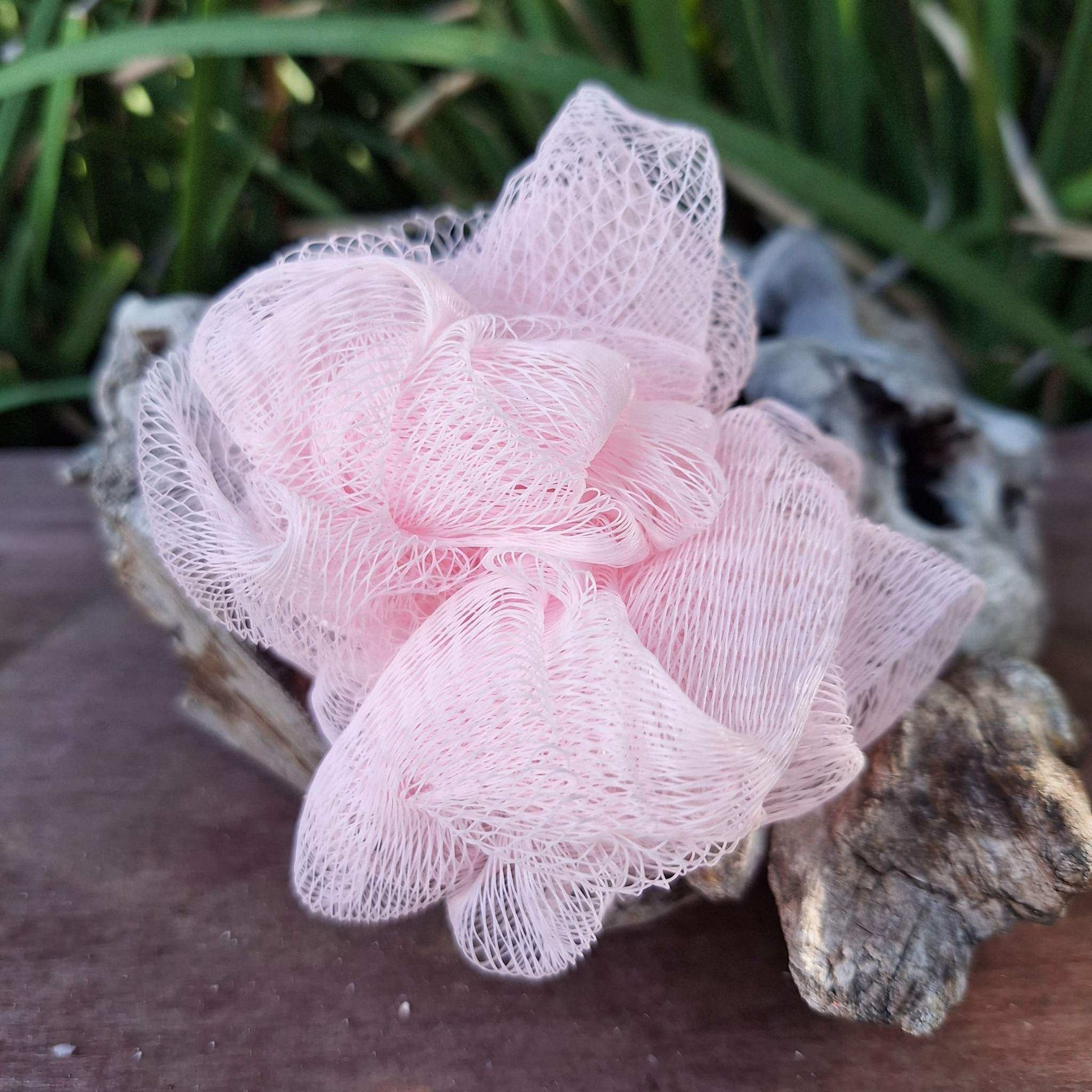 Pink bath & shower scrunchies for exfoliating and cleansing.