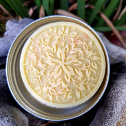 Pure Shower Lotion Bar with embossed design in metal tin, deep hydration and nourishment.