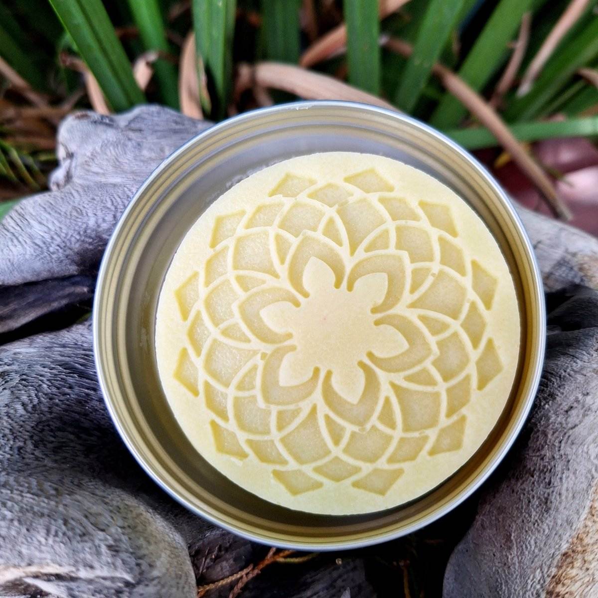 Pure Shower Lotion Bar with nourishing butters and oils in decorative tin.