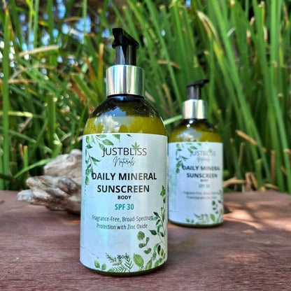 Daily mineral Body Sunscreen SPF 30 with non-nano Zinc Oxide and hemp seed oil, eco-friendly packaging on wooden table in nature.