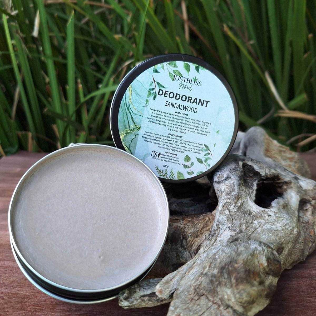 Natural Sandalwood Deodorant in open tin with green background.