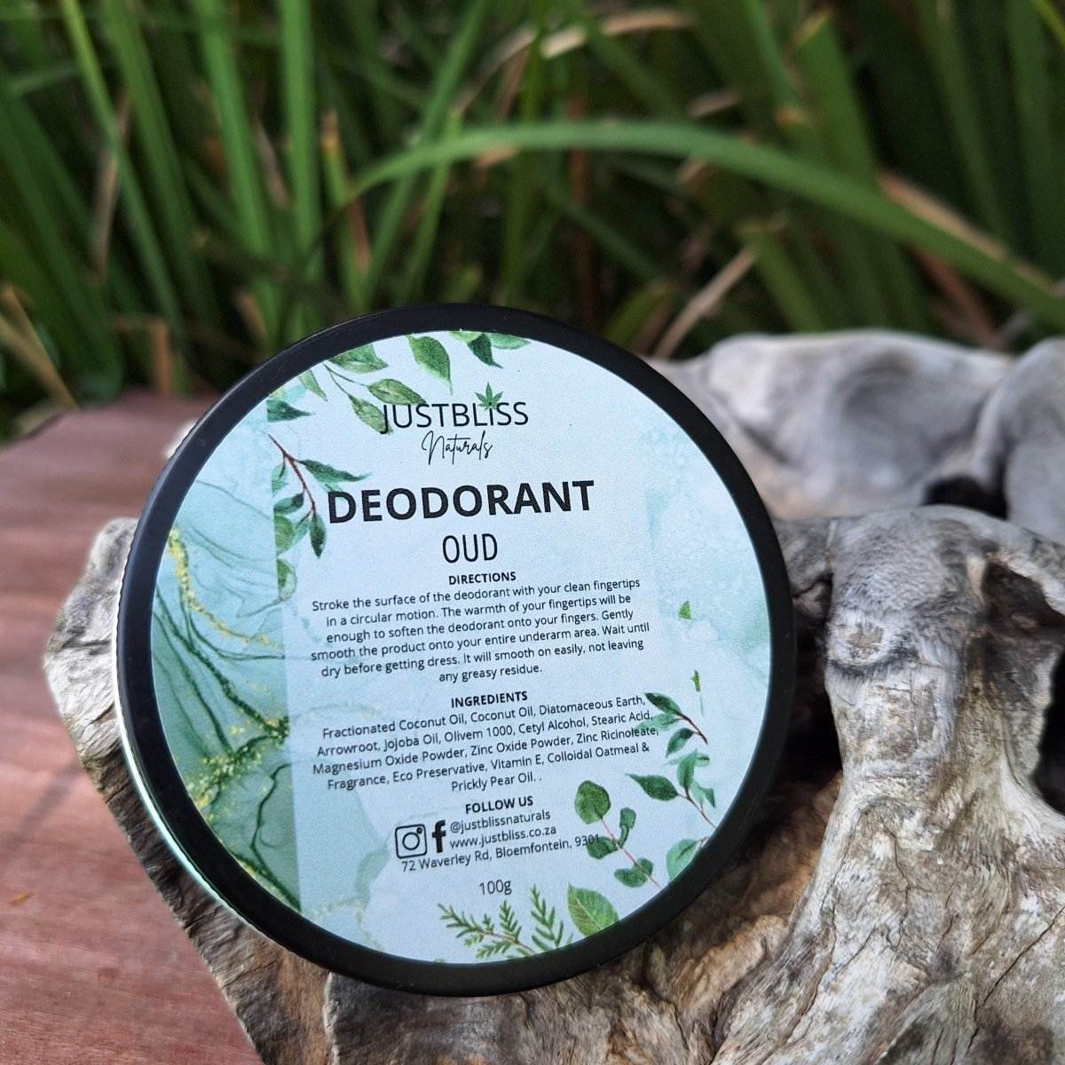 Natural Oud deodorant tin with green leaf design, 100g, for long-lasting odor protection.