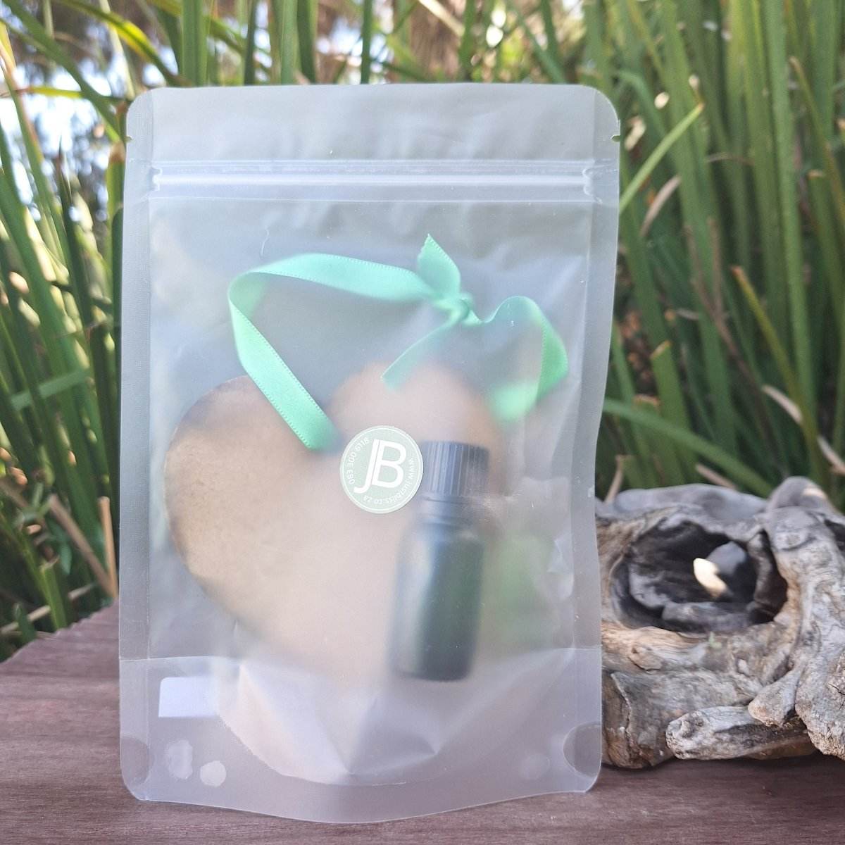 Wooden Hanging Diffuser with mystery scent with oil bottle in a resealable package.