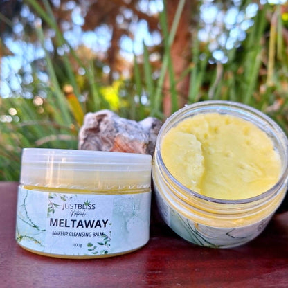 Meltaway Makeup Cleansing Balm in open container with creamy yellow texture, ideal for winter and dry skin.