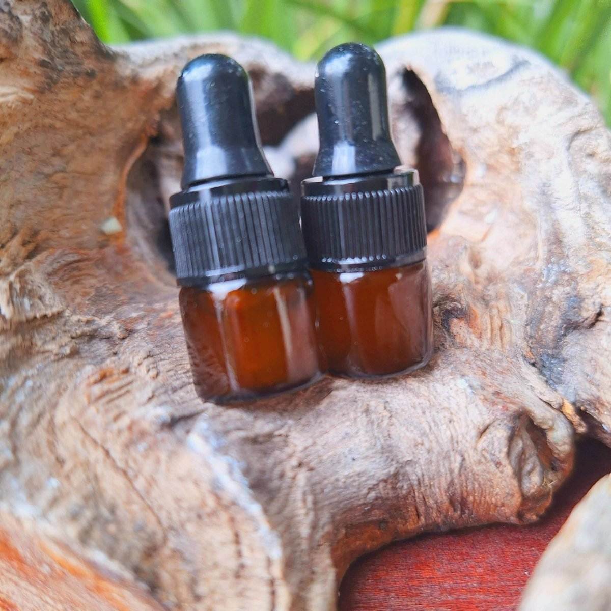 Prickly Pear Seed Oil tester bottles on natural wood background.