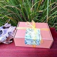 Aromatherapy Box 1 gift set with tea light candle, burner, and wax melt on outdoor surface.