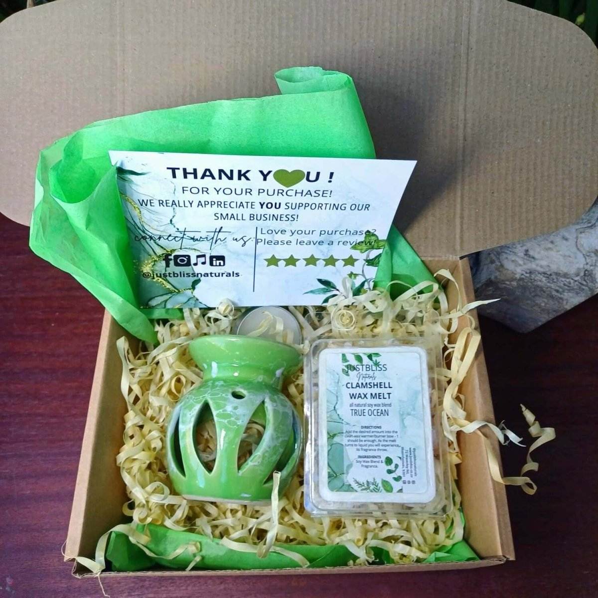 Aromatherapy Gift Box 1 with green tea light candle, burner, and clamshell wax melt displayed in a box.