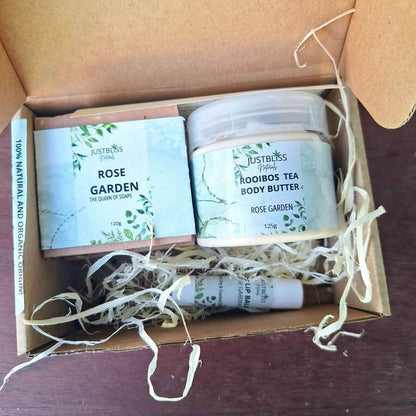 Bath, Body & Lip Set Aromatic Geranium in a gift box with two Rose Garden soap bars, Rooibos Tea body butter, and geranium lip balm.