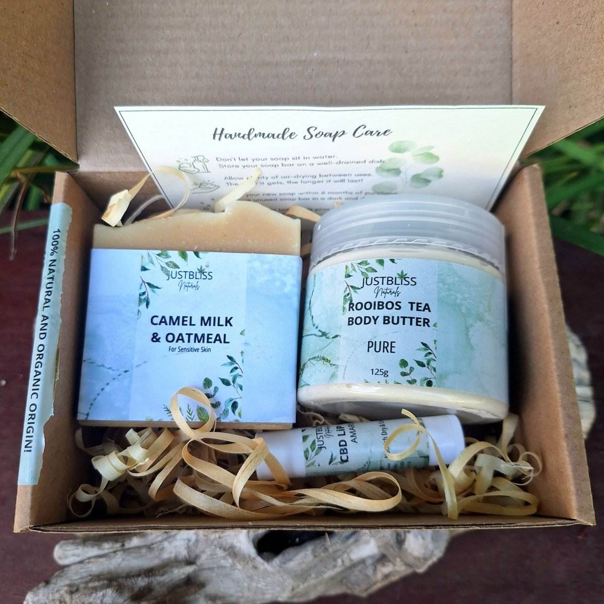 Gift box with unscented bath, body, and lip set for sensitive skin.