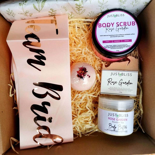 Bride-to-be gift box with rose garden body scrub, soap, bath bomb, body butter, and pink bridal sash.