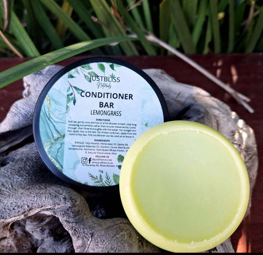 Lemongrass hair conditioner bar in a tin on natural background.