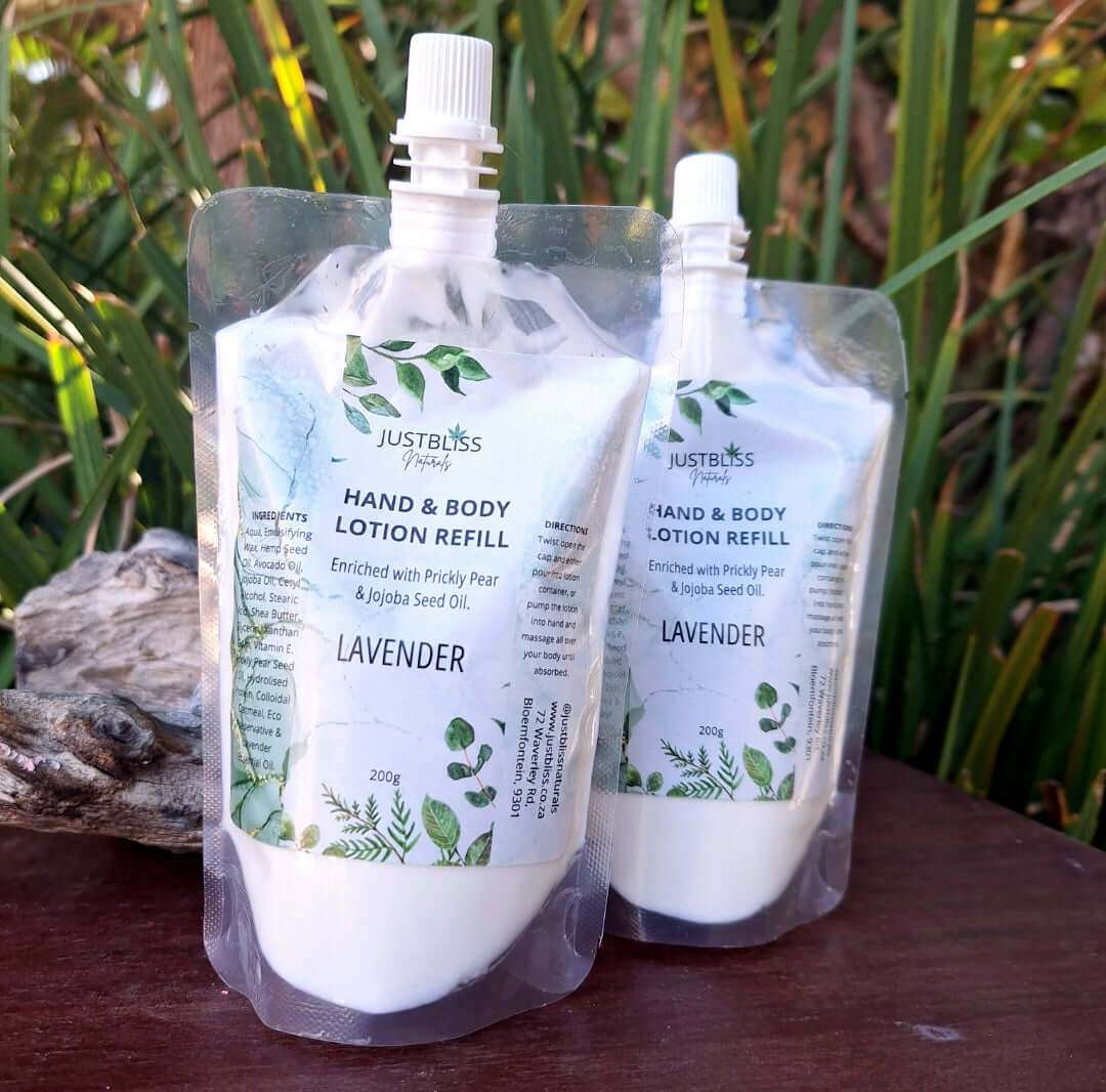 Hand and body lotion refill packs (200g) with natural oils, labeled "Lavender" by JUSTBLiSS, displayed outdoors.