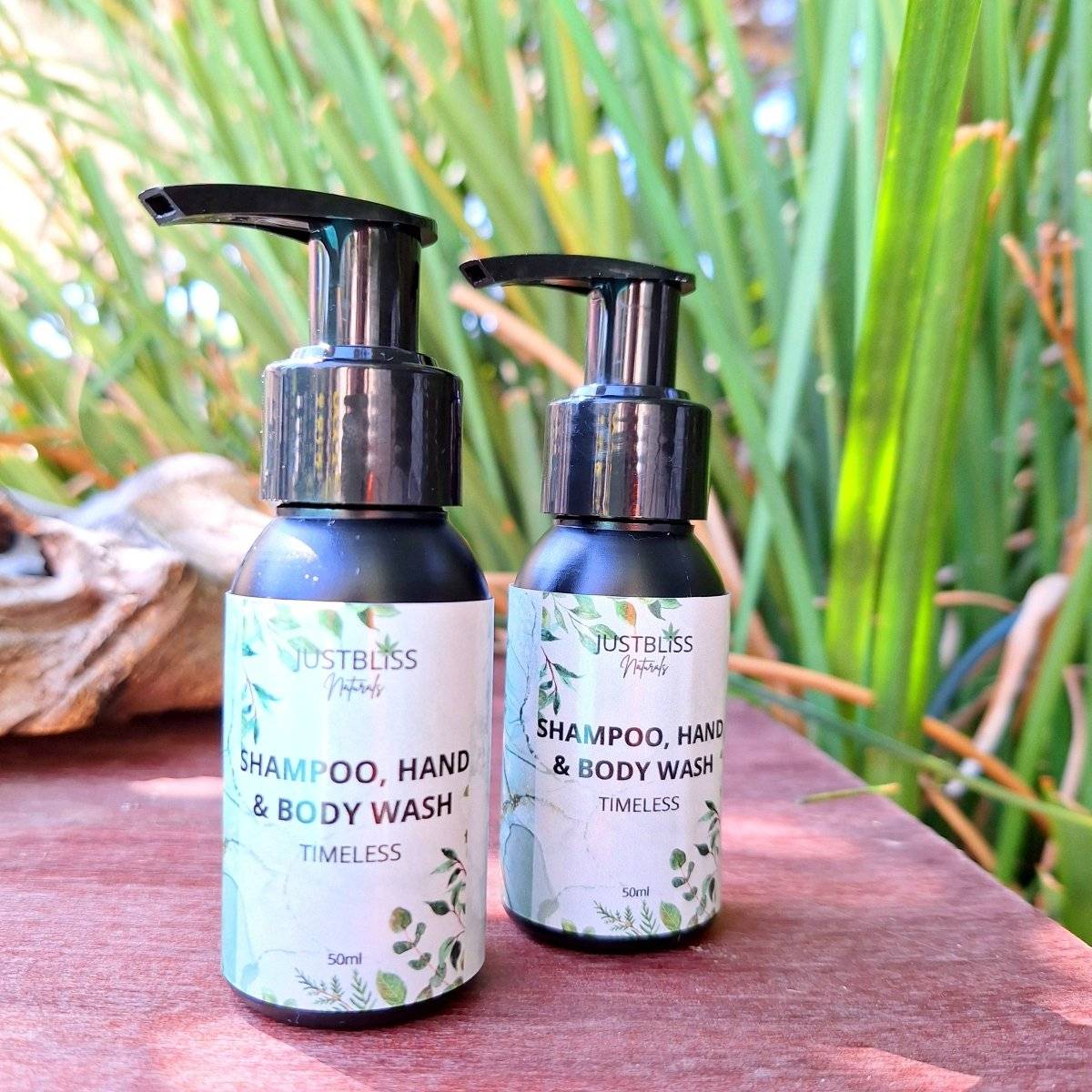 Travel-size HAND and BODY WASH bottles, 50ml, suitable for all skin types, free of parabens and sulfates, by JUSTBLiSS Naturals.