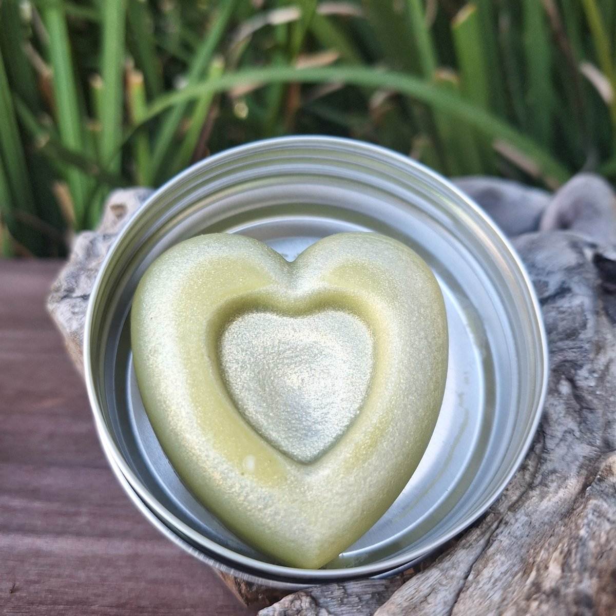 Heart-shaped Veora lotion bar in reusable metal tin, perfect for moisturizing and soothing dry skin.