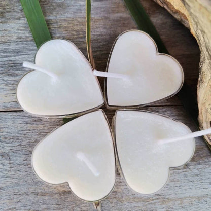 Heart-shaped soy tealight candles (15g) with hemp wicks on wooden surface.