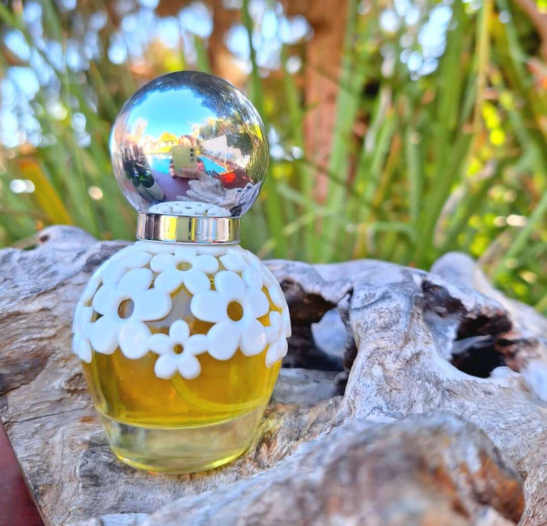 30ml Isadora floral perfume with floral and woody notes, elegant packaging.