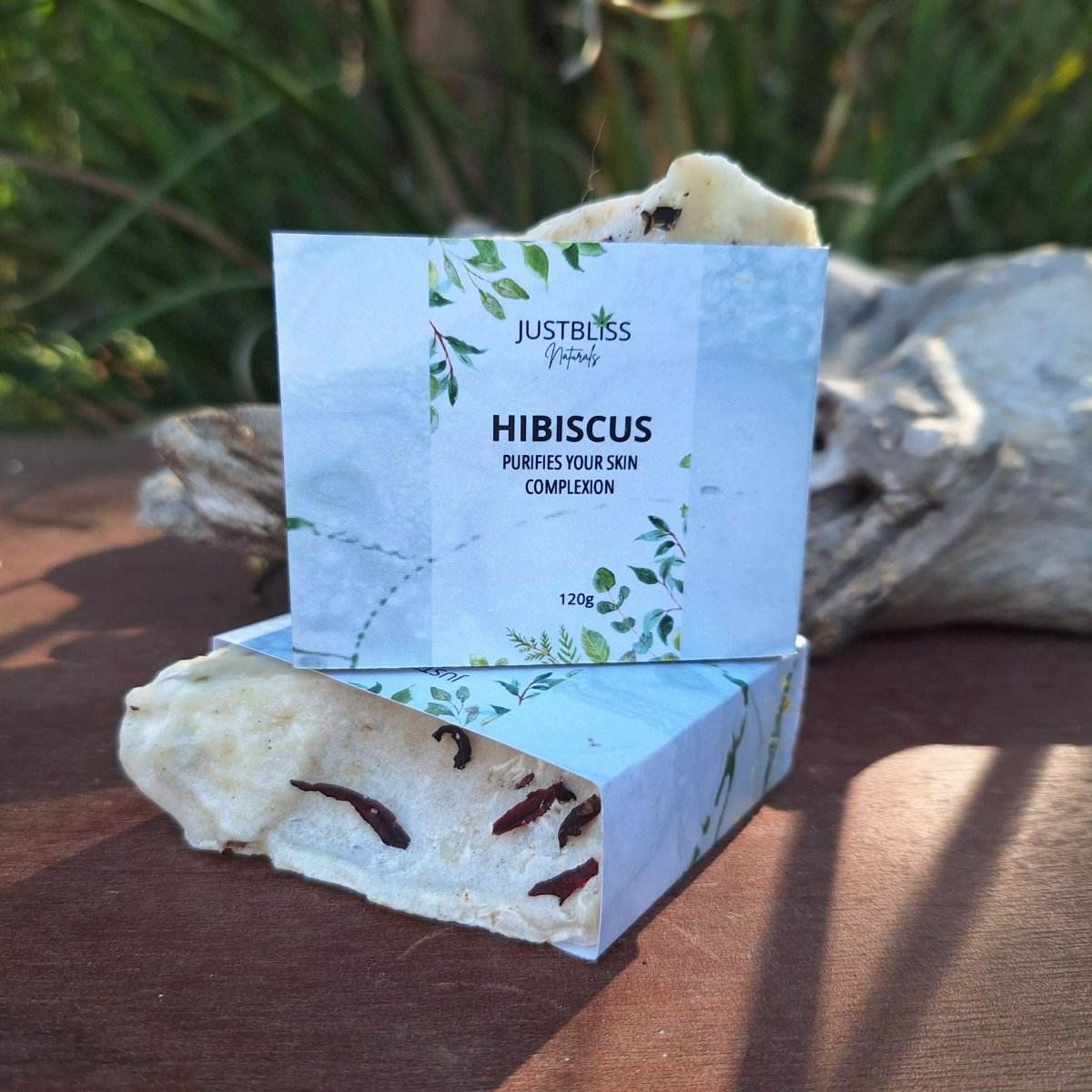 Hibiscus soap bar with natural skincare benefits, featuring avocado and rosehip oils for hydration and skin repair.